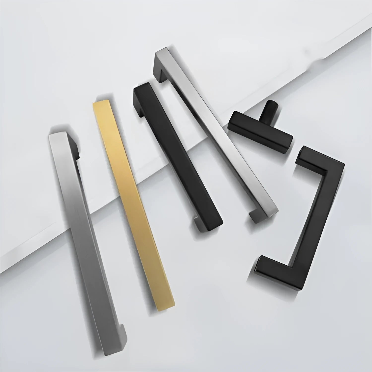 Stainless steel square pipe cabinet door handle in brushed silver finish, shown alongside matte black and brushed gold options.
