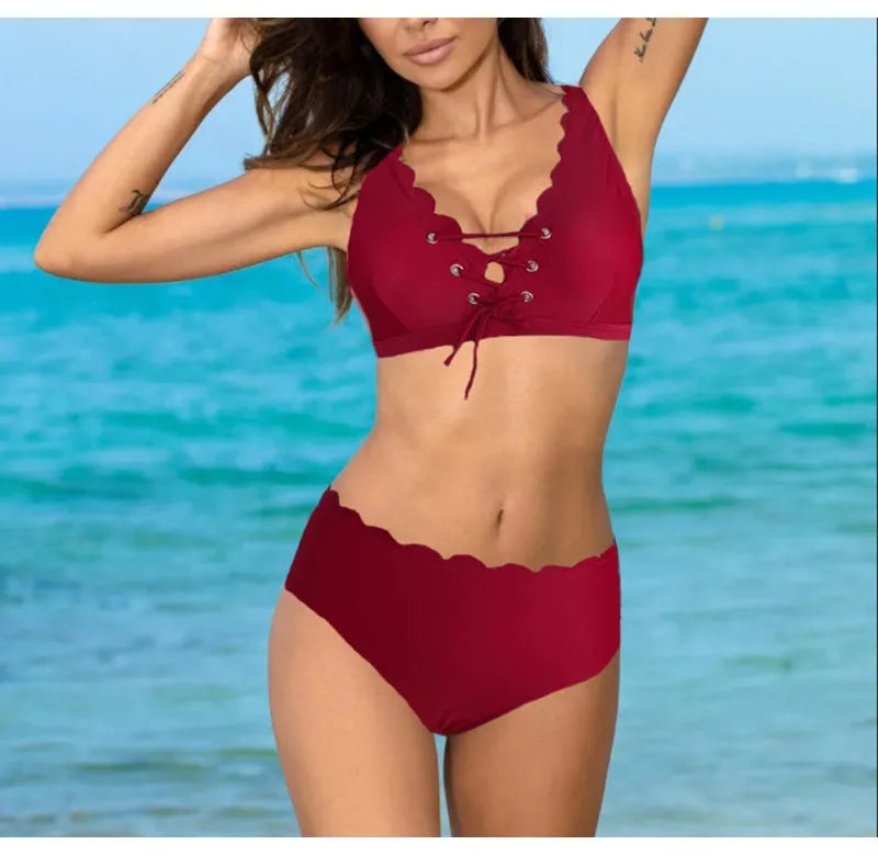 Women's solid colour polyester split swimsuit with gathering detail on a brief