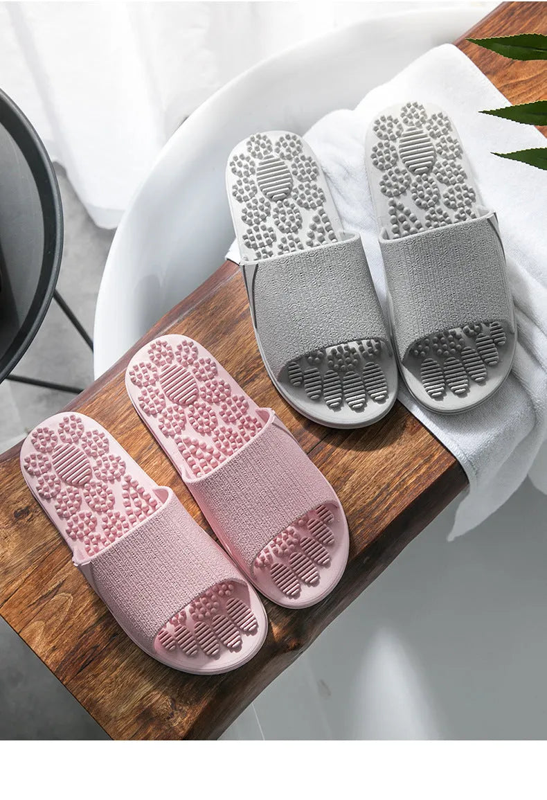 Pair of reflexology foot massage slippers with 3D acupressure particles, blue colour, on a light background