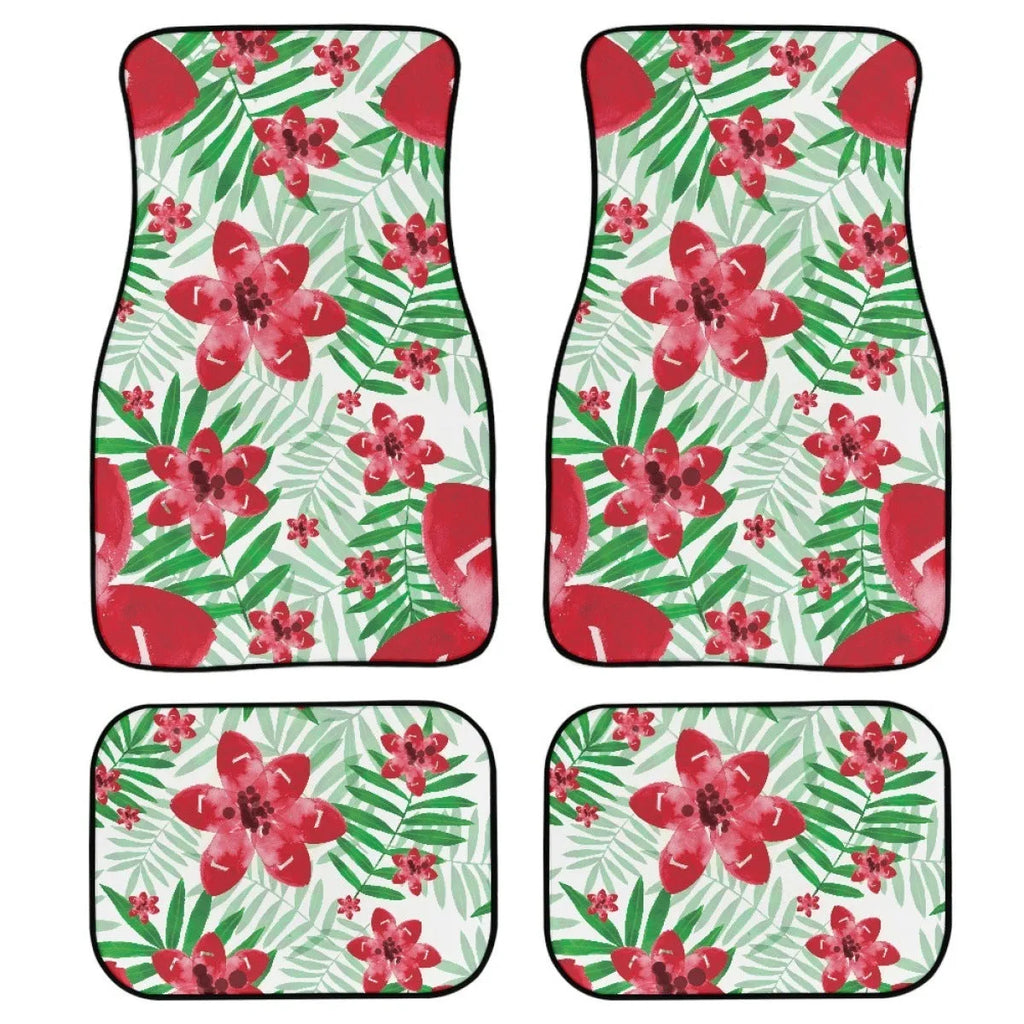 Four-piece set of black printed rubber car floor mats with textured surface.