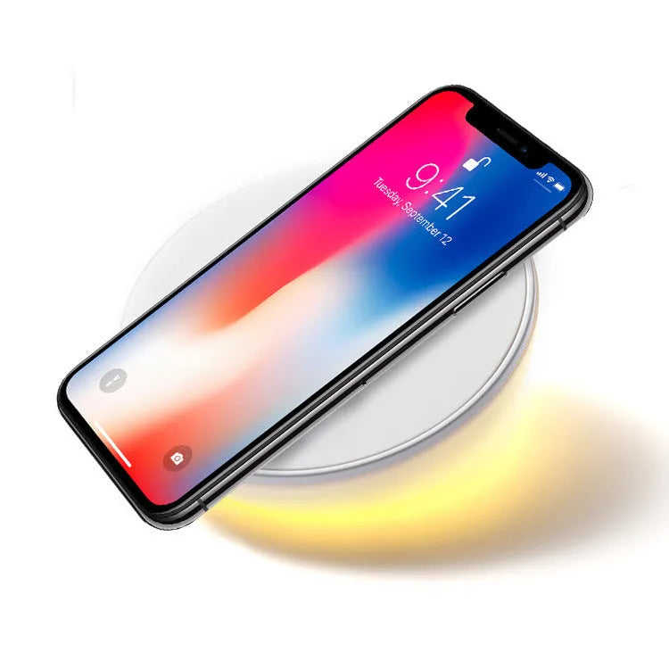 White wireless phone charger with digital clock display and control buttons