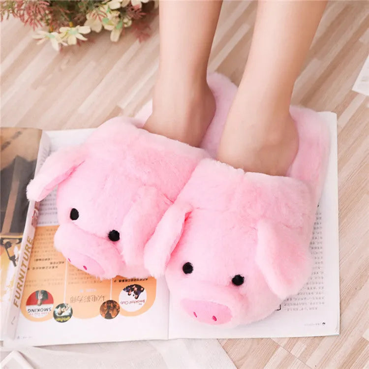 Pink pig-shaped floor slippers made of short plush material.