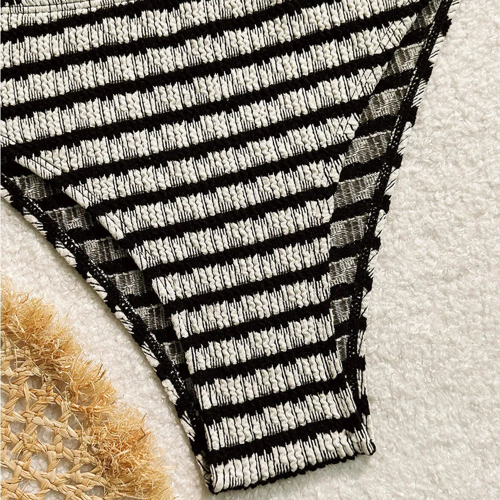 Women's striped bikini swimsuit in polyester fabric available in pink or black