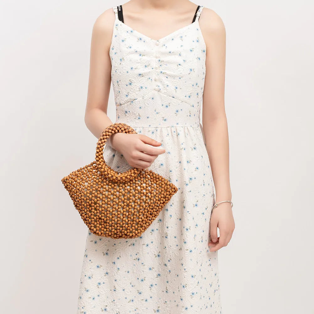 Hand-woven maple beach bag with wooden bead decoration showing hollow dumpling design