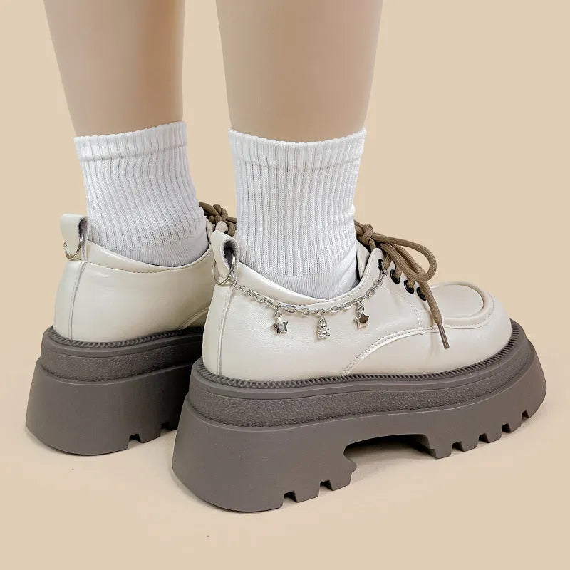 White platform Mary Jane shoes with chunky heel and lace-up front
