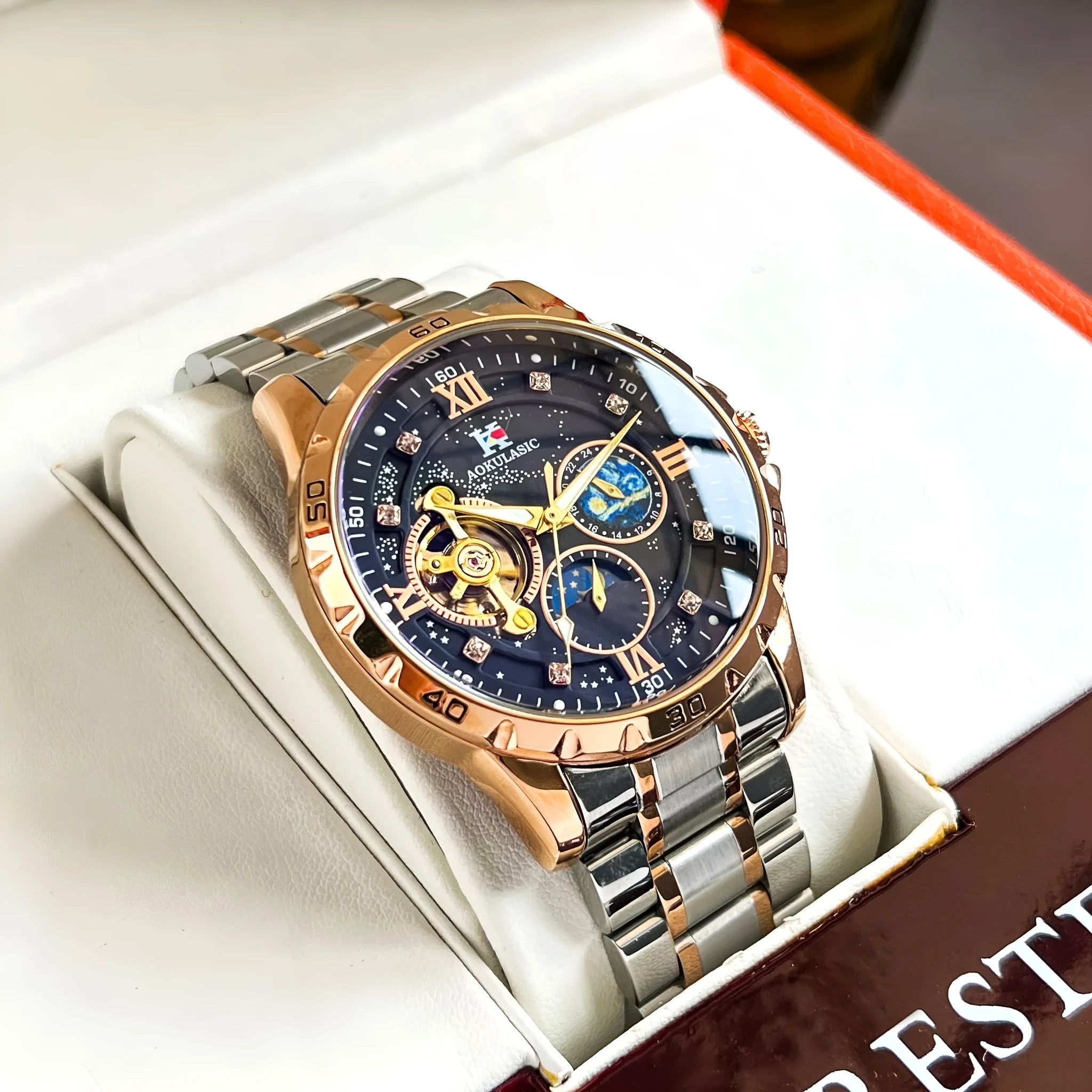 Rose gold automatic men's watch with large black dial and stainless steel case