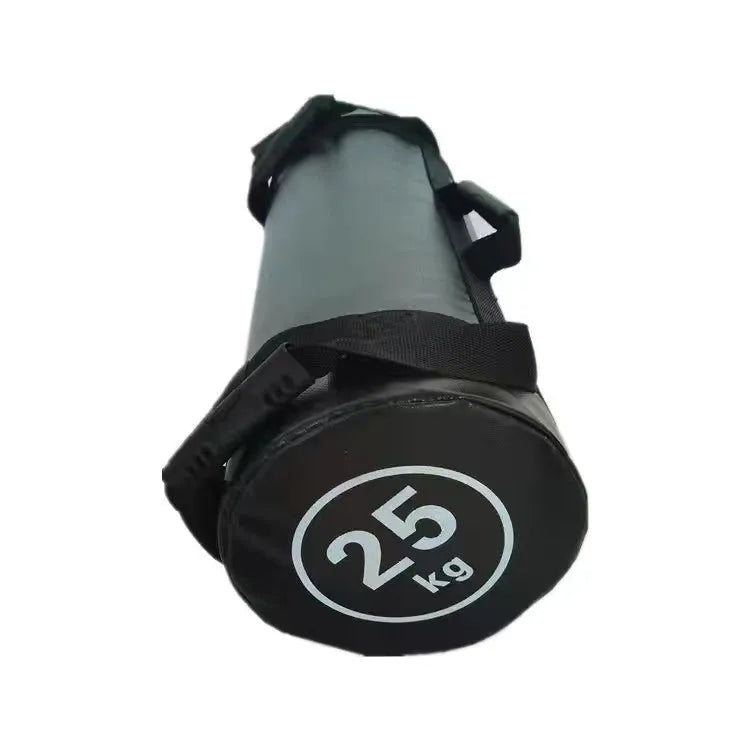 Flat white leather PVC fitness training sandbag for weight lifting on a gym floor.