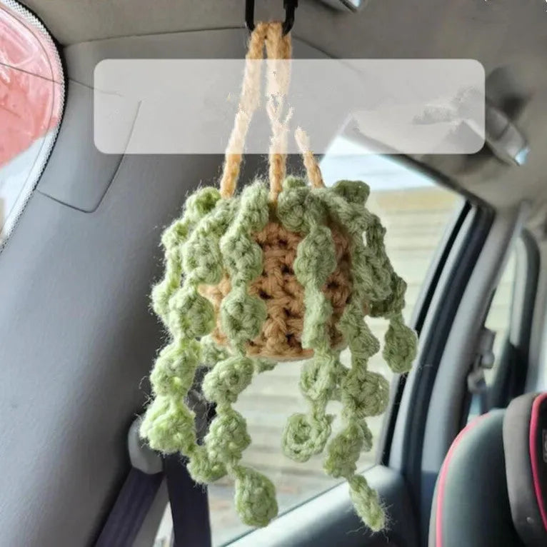 Green and white knitted wool plant ornament for car dashboard with hanging cord