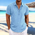 Men's light grey loose fit lapel cardigan with long sleeves on a hanger.