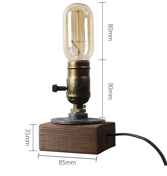 Compact wooden and iron water pipe style table lamp on a surface