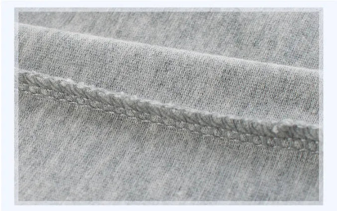 Grey cotton children's T-shirt shown with a size chart listing measurements for heights 90cm to 140cm.