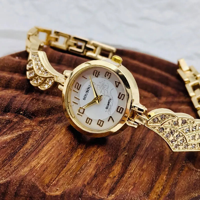 Stainless steel women's watch with round dial and Vachette clasp in gold, black and gold, or gold and white.