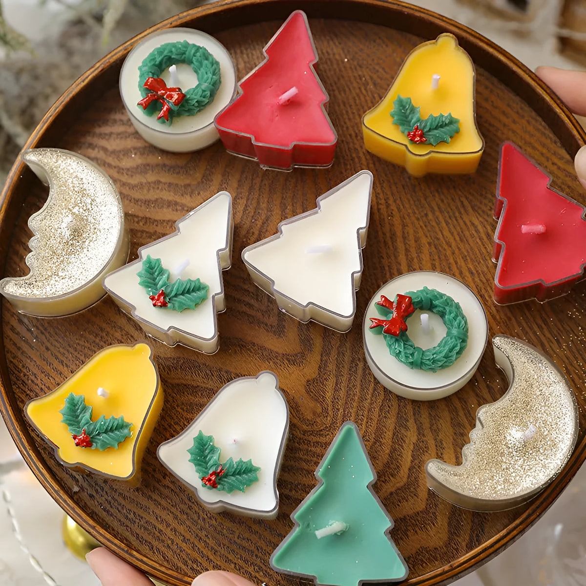 Hand-poured Christmas tea wax candle in cup shape with soy wax blend, available in tree, bell, moon, and leaf designs.