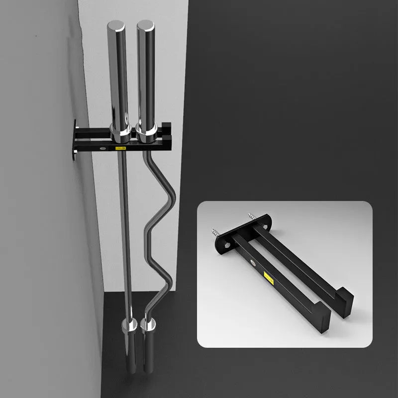 Wall-mounted black steel barbell rack holding multiple Olympic bars against a wall