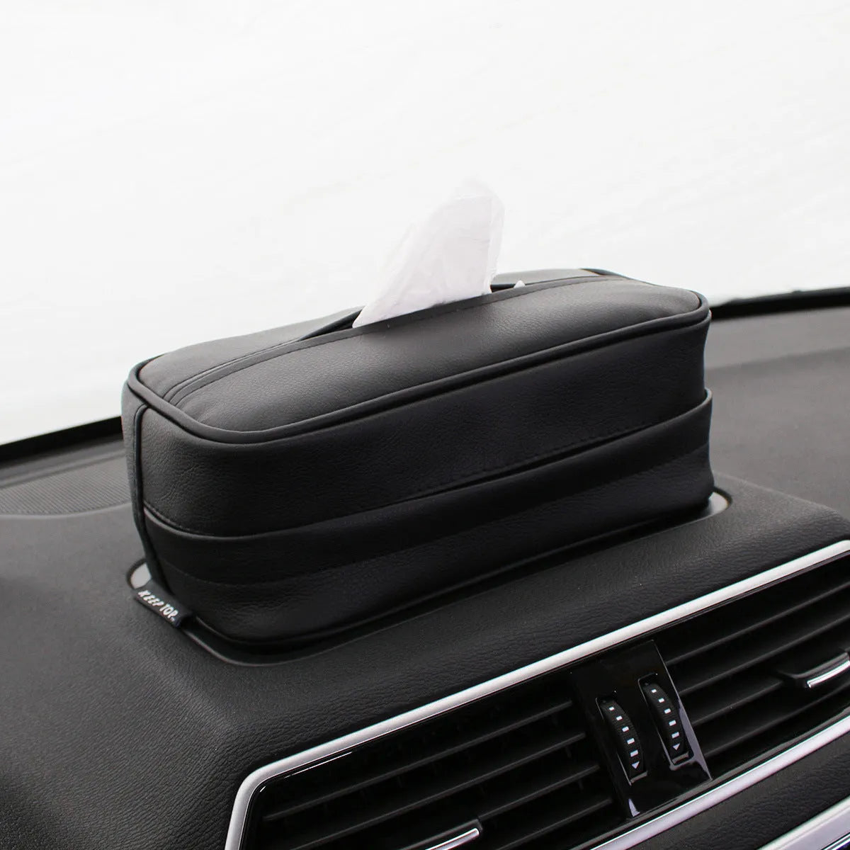 Black and beige PU leather hanging storage box for car, home and outdoor use.