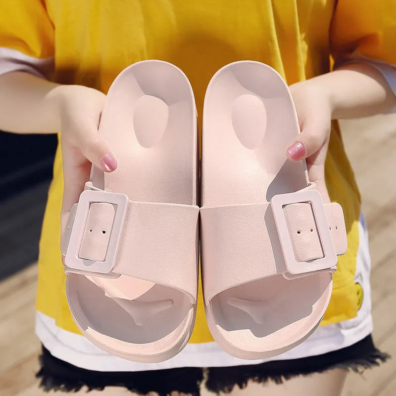 Women's grey blue flip-flop slippers with a soft EVA sole and a silver single buckle.