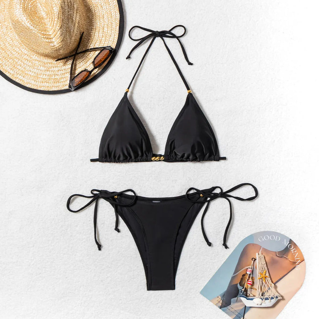 Black women's bikini swimsuit with metal bead decoration on the front.