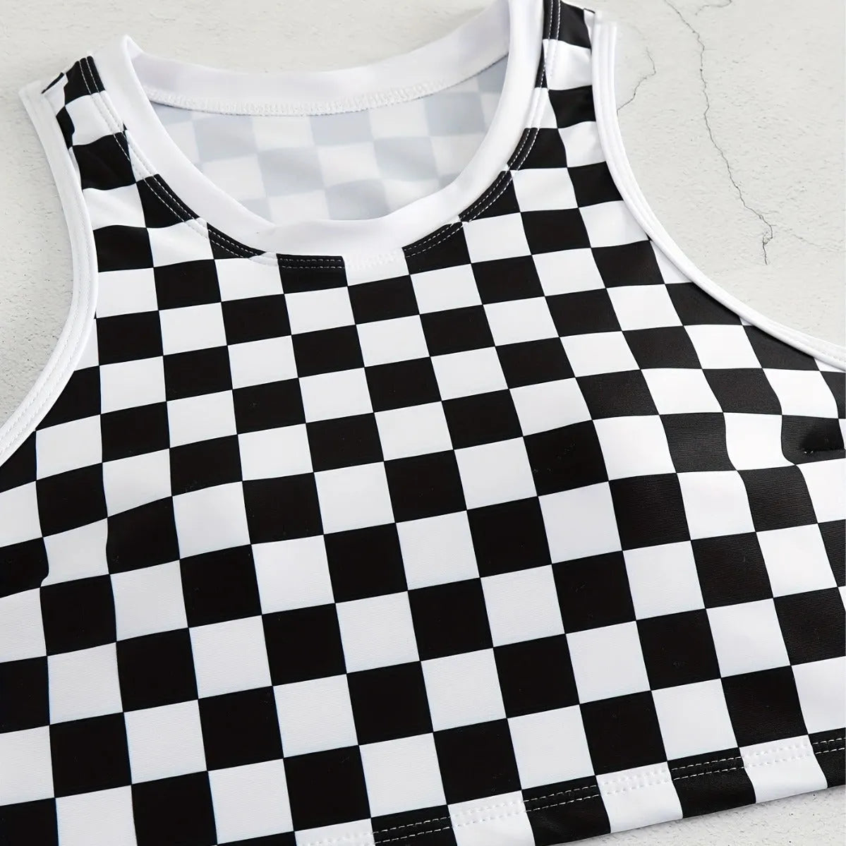 Women's checkerboard pattern racing one-piece swimsuit with backless design and suspender straps