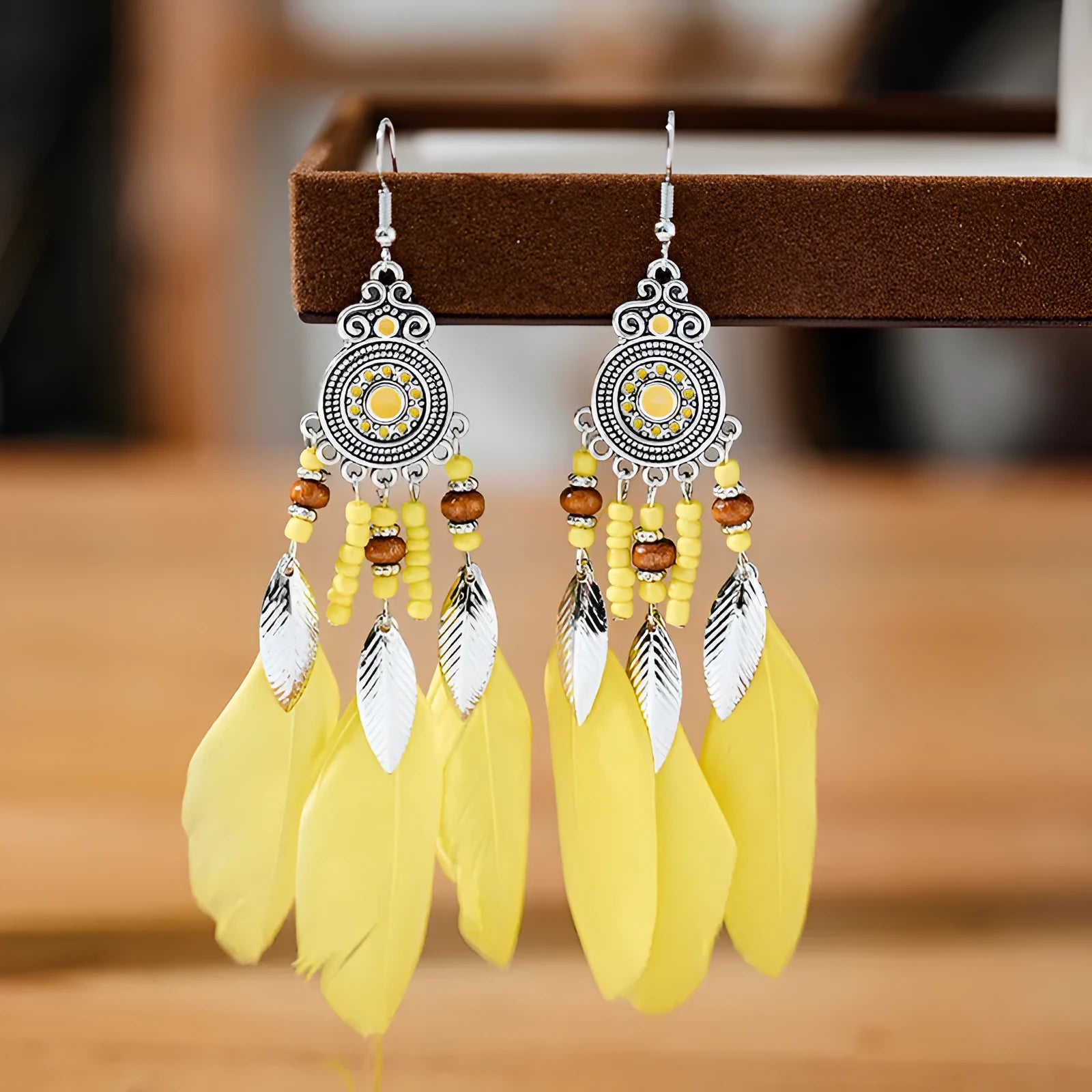 Round drop feather earrings with leaf design in bohemian style available in thirteen different colours