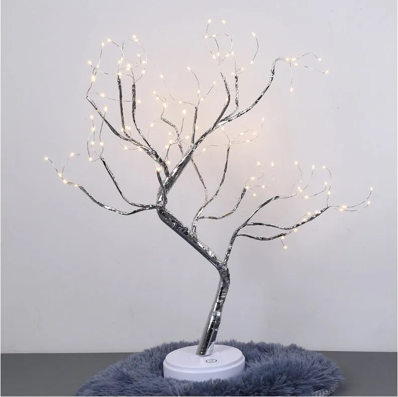 Tree light night light with bonsai-style design, warm white LED lights, adjustable branches, and USB plug.