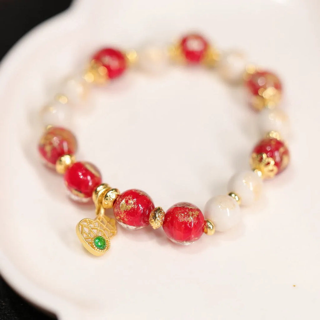 Gold foil coloured glaze ethnic bracelet for women with geometric design and Xingshi elements