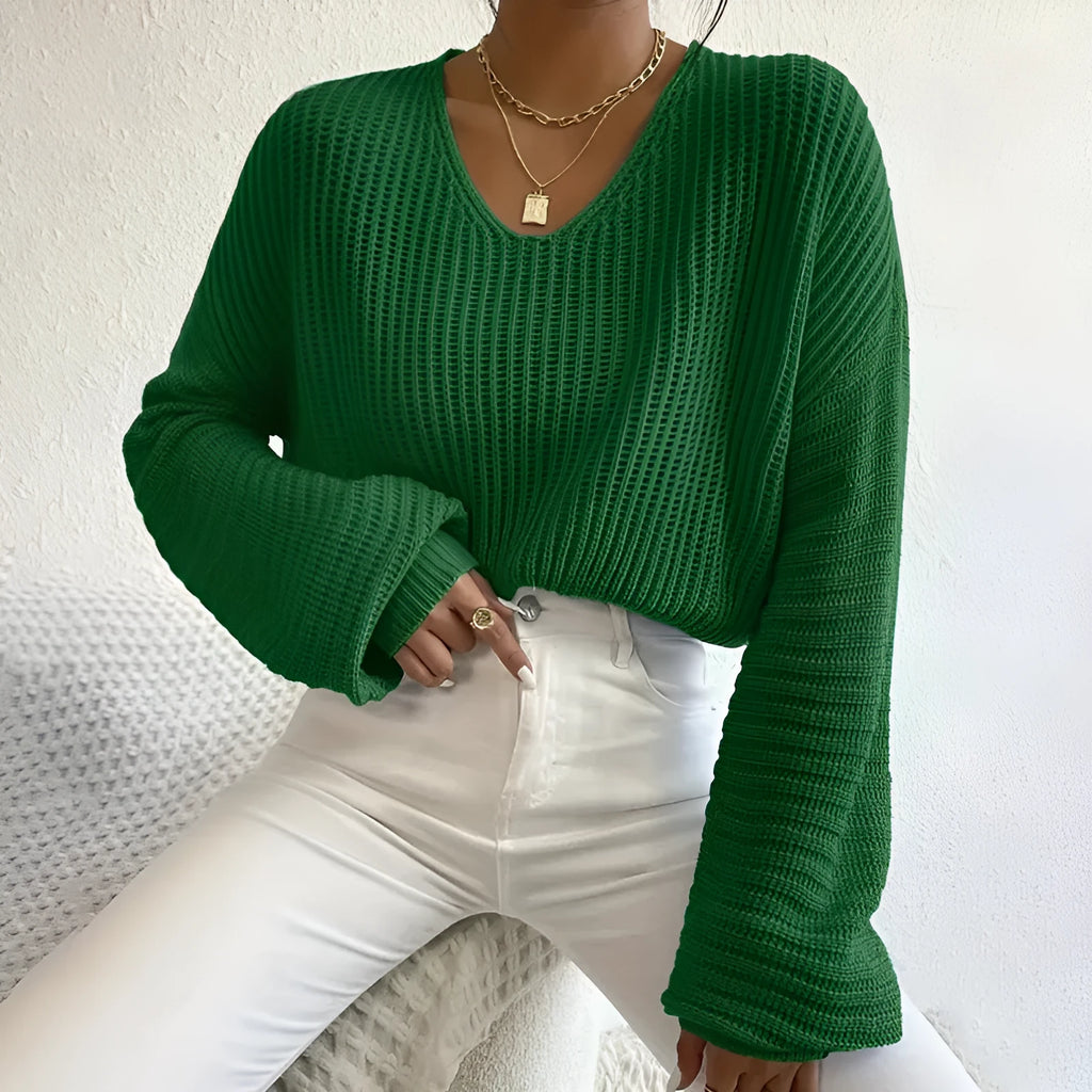 Women's solid colour long sleeve pullover top in a casual loose fit.