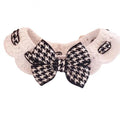 Red and black houndstooth pattern wool knitted dog collar shown in four sizes on a table.
