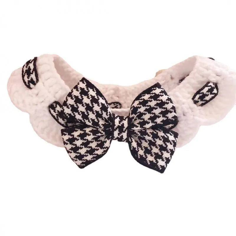 Red and black houndstooth pattern wool knitted dog collar shown in four sizes on a table.