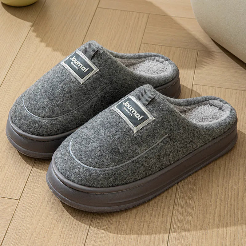 Men's grey suede slippers with thickened bottom and EVA sole showing extended sizing label