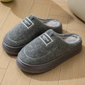 Men's grey suede slippers with thickened bottom and EVA sole showing extended sizing label