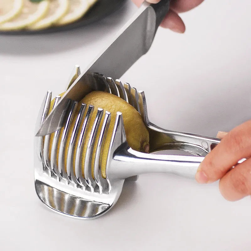 Silver plastic foldable lemon slicer kitchen gadget shown cutting citrus fruit