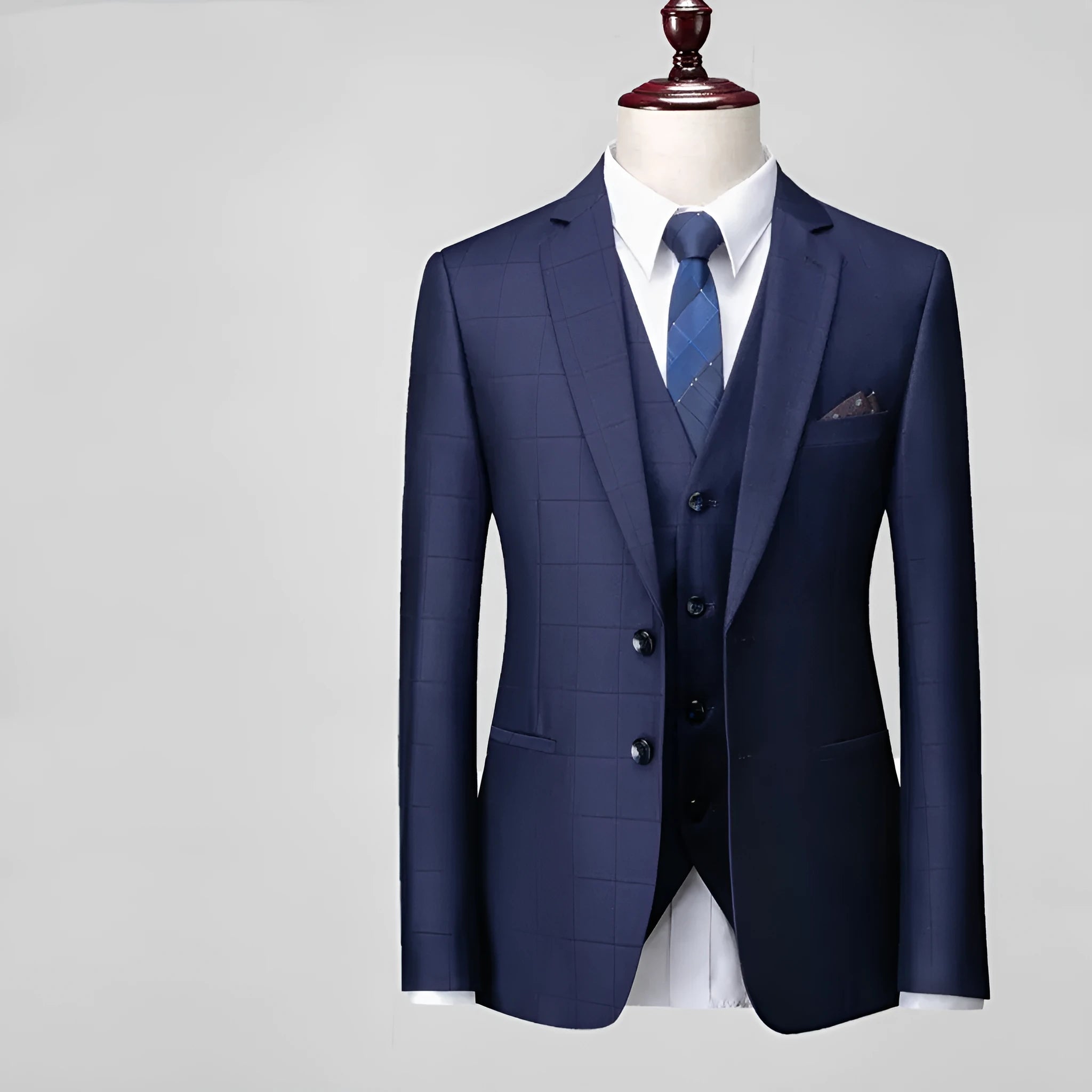 Men's slim fit plaid three-piece suit in navy blue with jacket, vest, and trousers