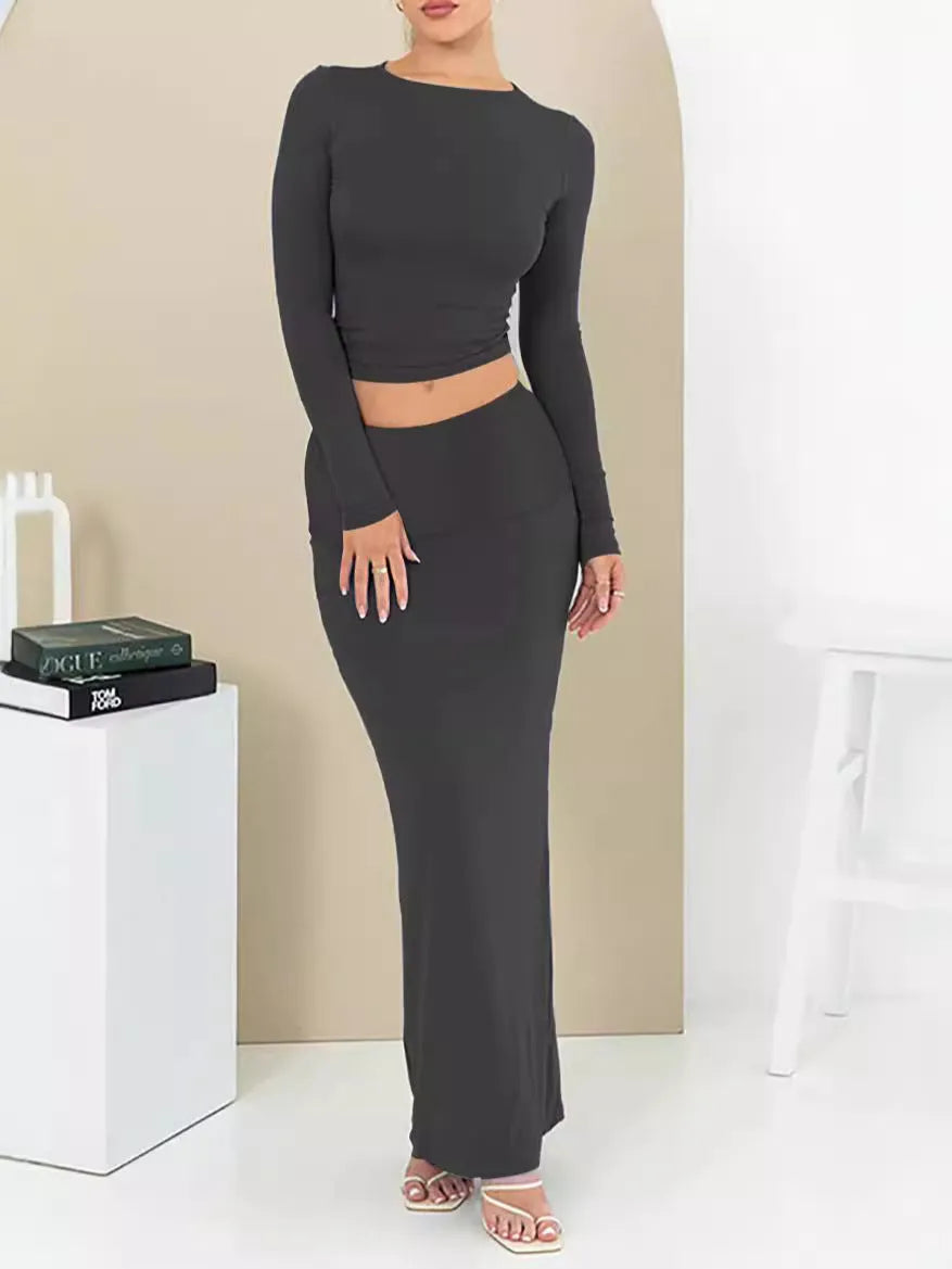 Women's pure colour slim fit two-piece suit with long skirt and three-quarter sleeve top for autumn.