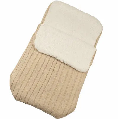 Envelope-style baby stroller sleeping bag in a plain colour, shown on a pram with lamb cashmere lining visible.
