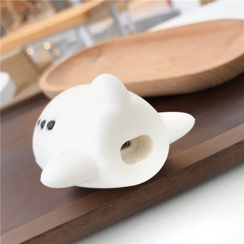 Blue silicone flip case for AirPods with cartoon airplane design and metal carrying hook.