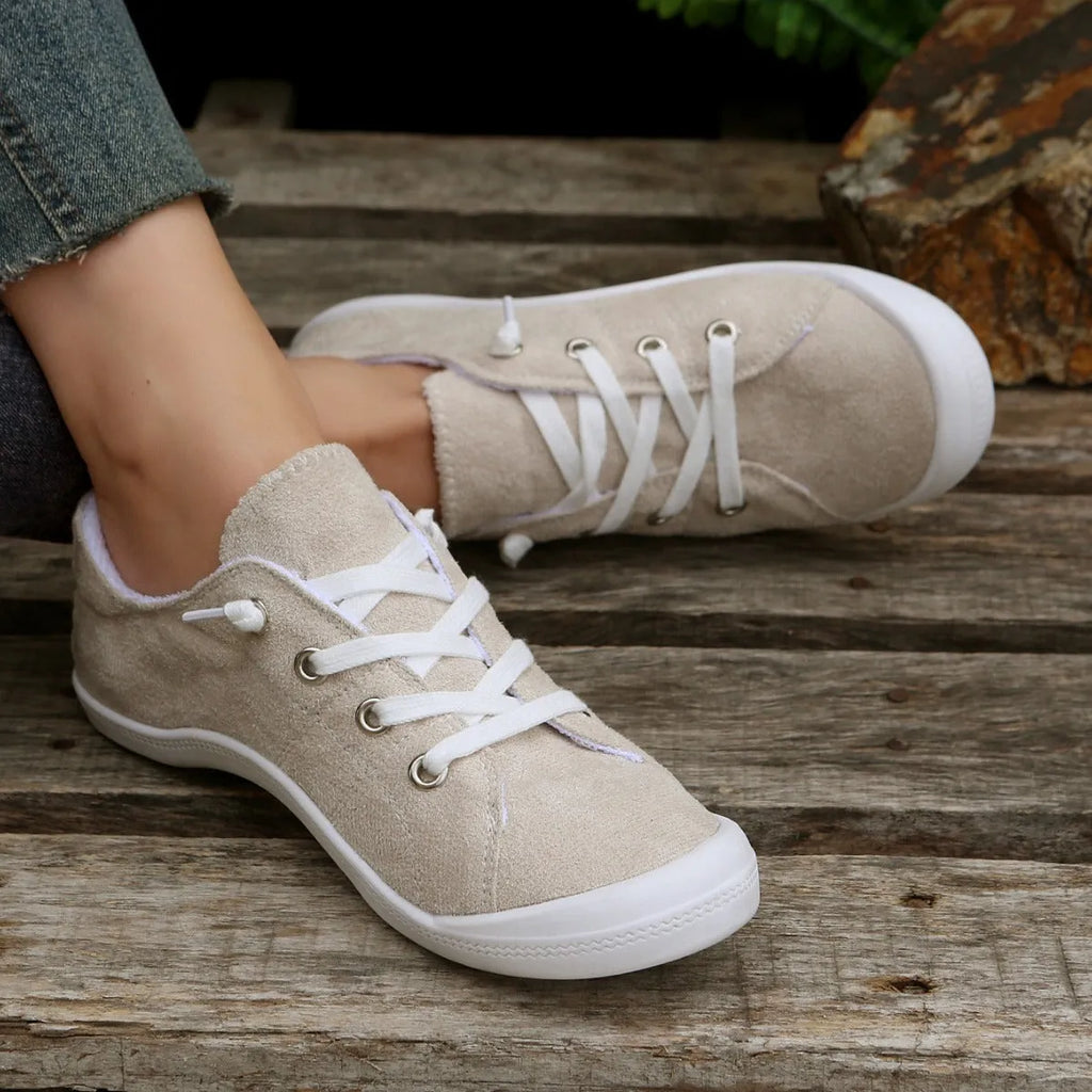Women's creamy white casual sneakers with soft fabric upper and rubber sole