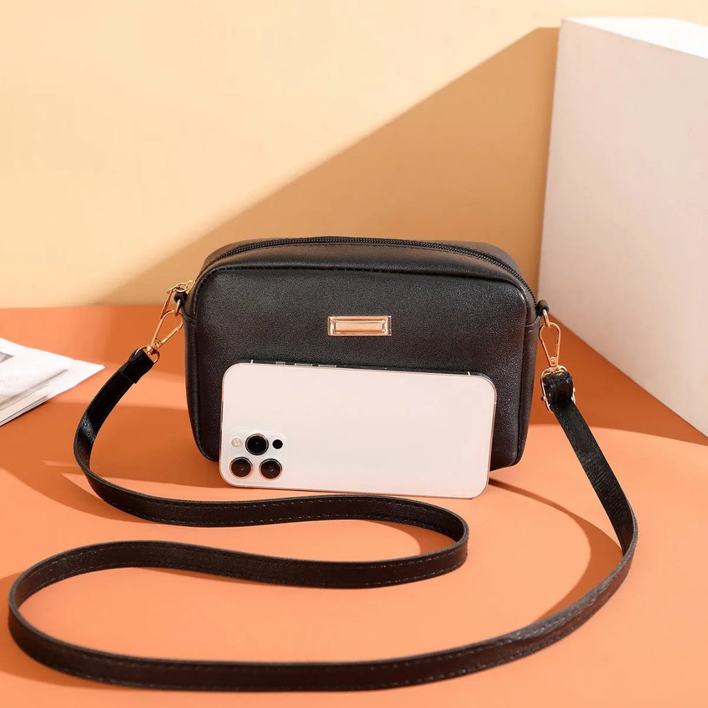 Solid colour PU ladies' shoulder bag in urban simplicity style with three-dimensional pocket.
