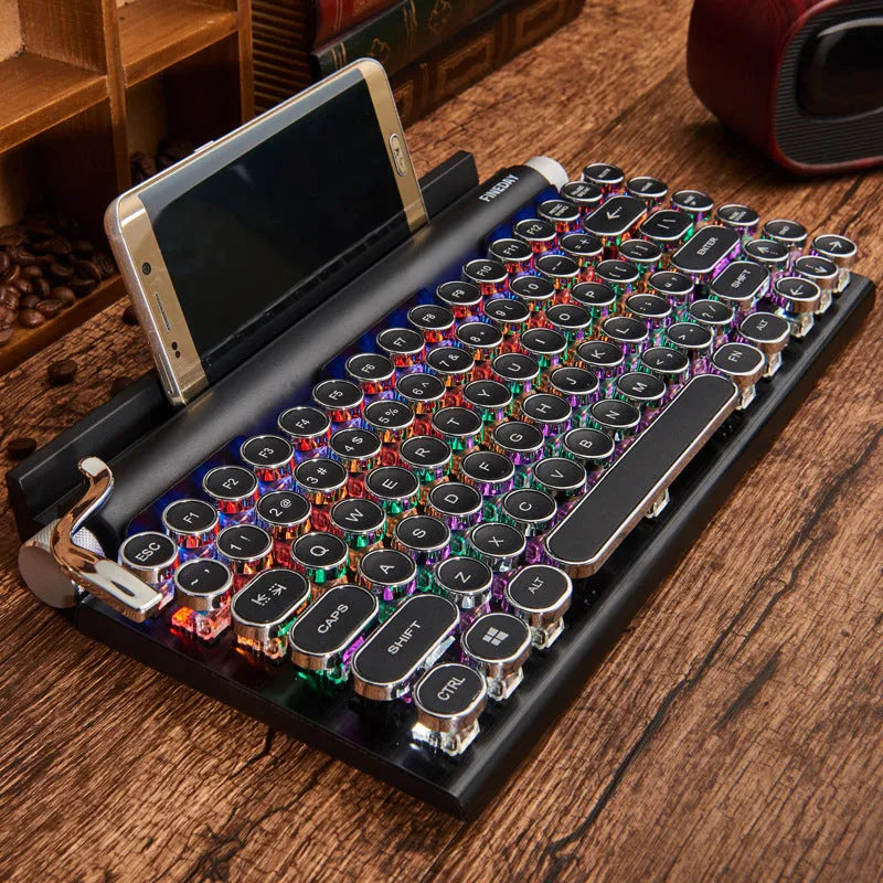 Black dot retro style mechanical keyboard with colourful backlit keys on a desk.