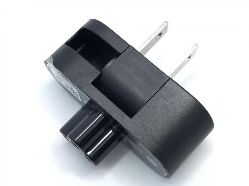 Black folding US plug travel adapter showing plug in both straight and folded positions