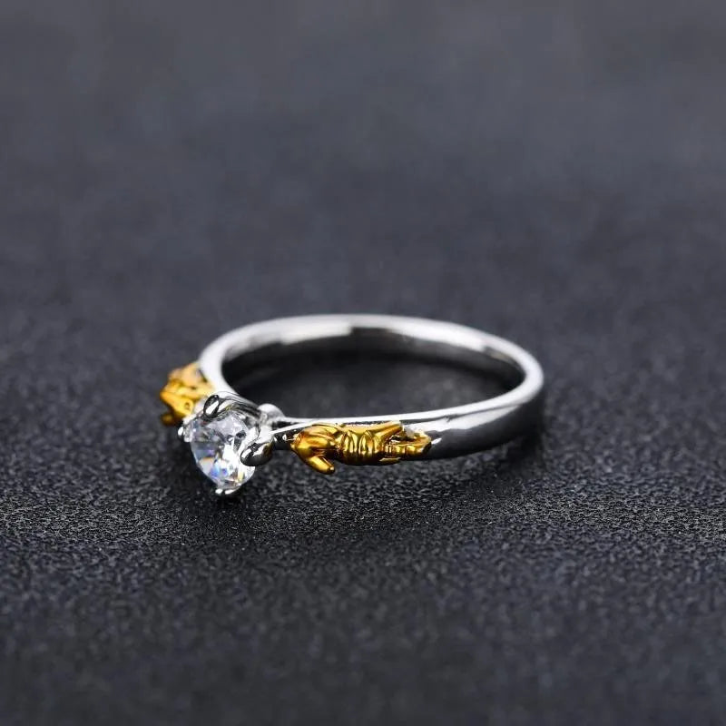 Copper crown motif cosplay ring in a black gold finish.