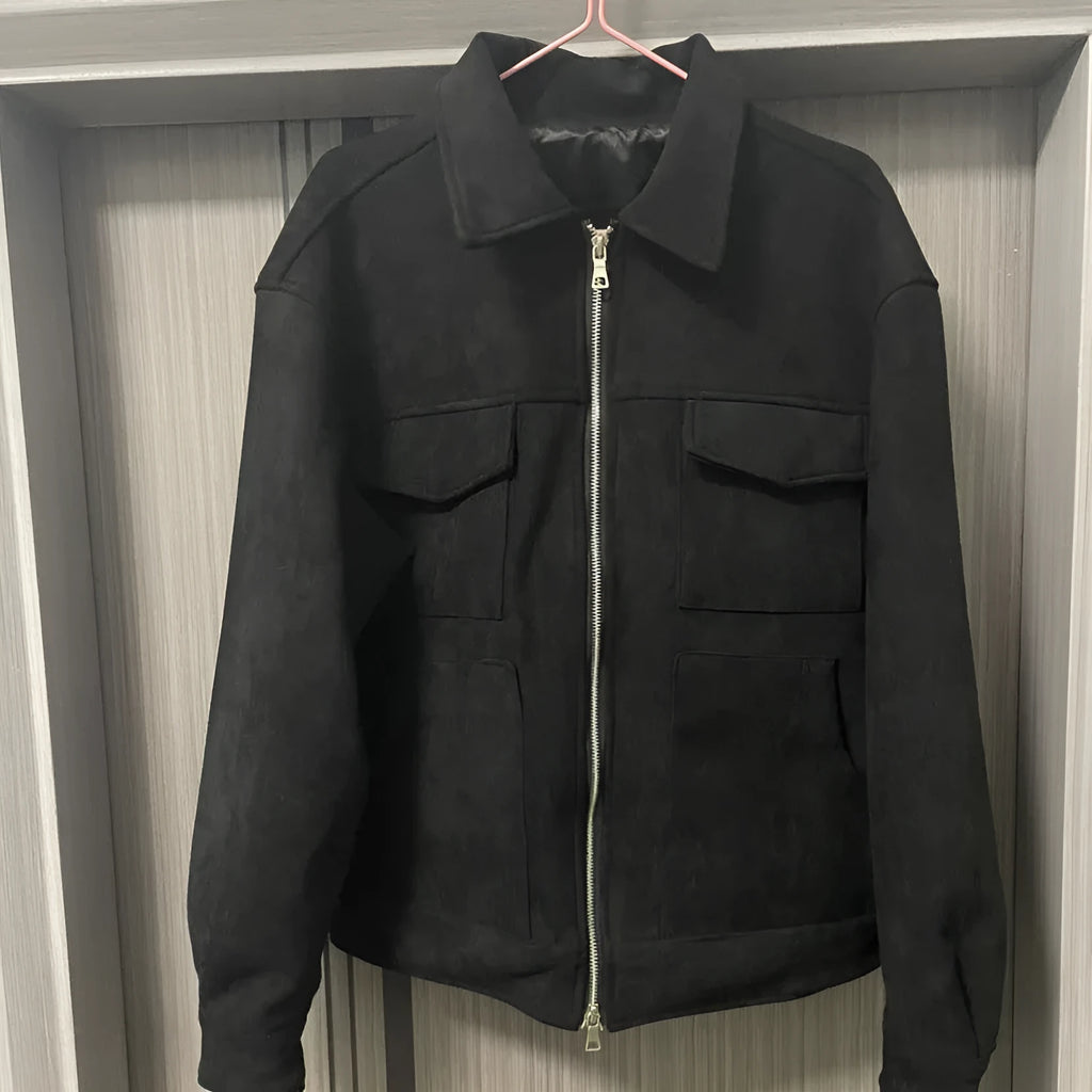 A man's slim-fit jacket in camel colour with a thickened zipper and large side pockets.