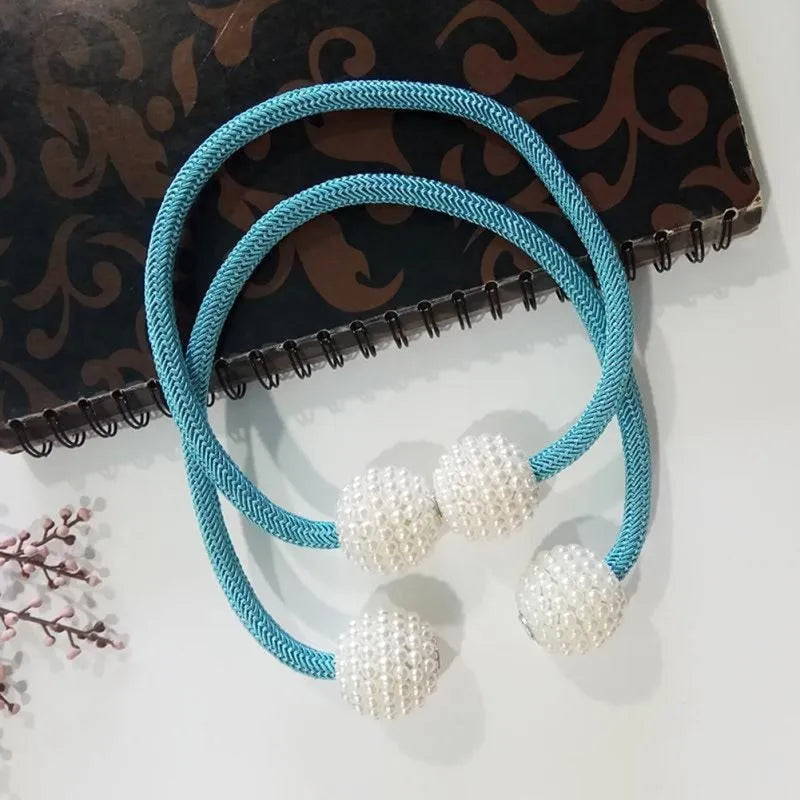 Magnetic curtain tiebacks with pearl beads in multiple colour options on white background