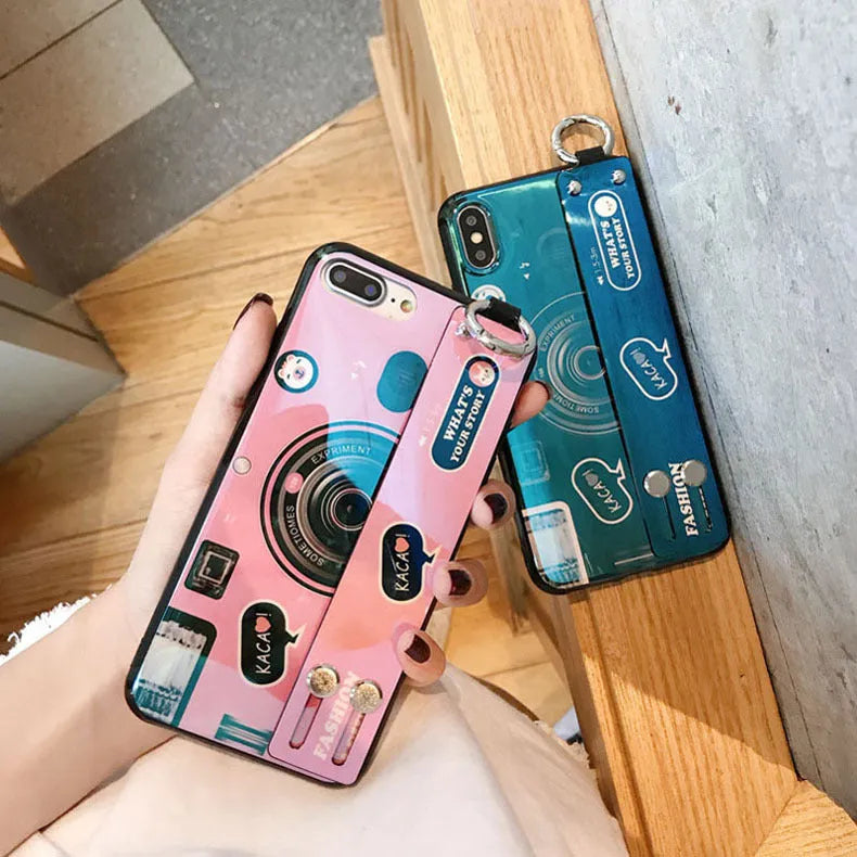 TPU iPhone case with retro camera design in blue or pink, back cover style, optional wrist strap.