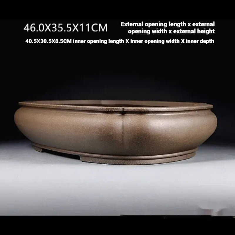 Handmade antique papaya-shaped flower pot made from natural purple clay.
