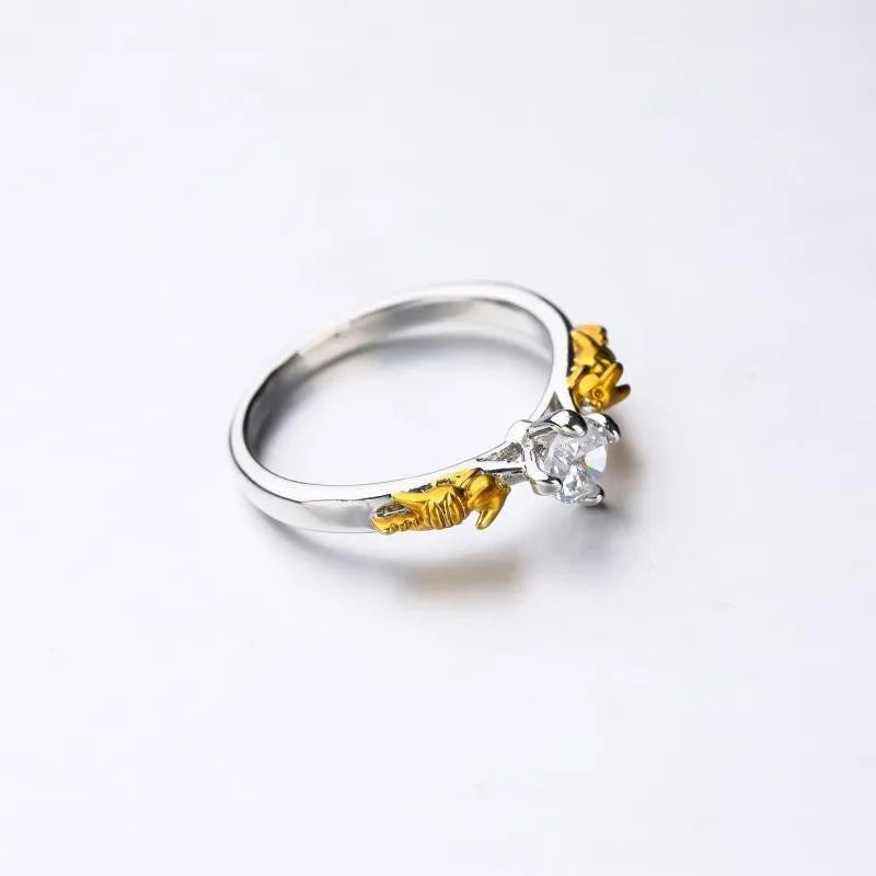 Copper crown motif cosplay ring in a black gold finish.