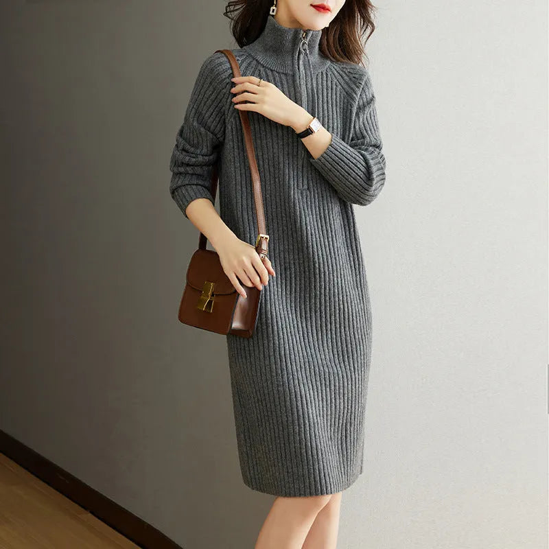 Beige woolen skirt with half zipper front, stand collar and loose long sleeves in straight dress silhouette