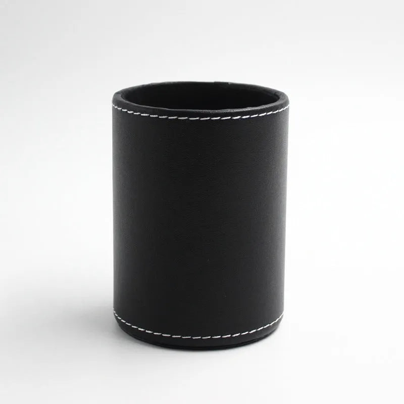 Black leather round pen container showing cylindrical shape for desk organisation