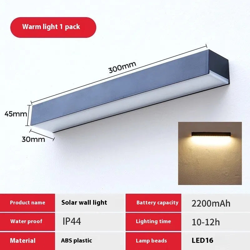Black solar-powered outdoor wall lamp with solar strip, suitable for garden or yard.