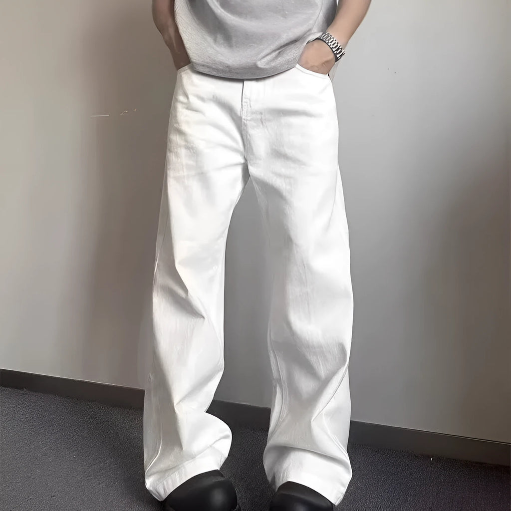 Men's loose straight wide leg white cotton denim jeans on a plain background