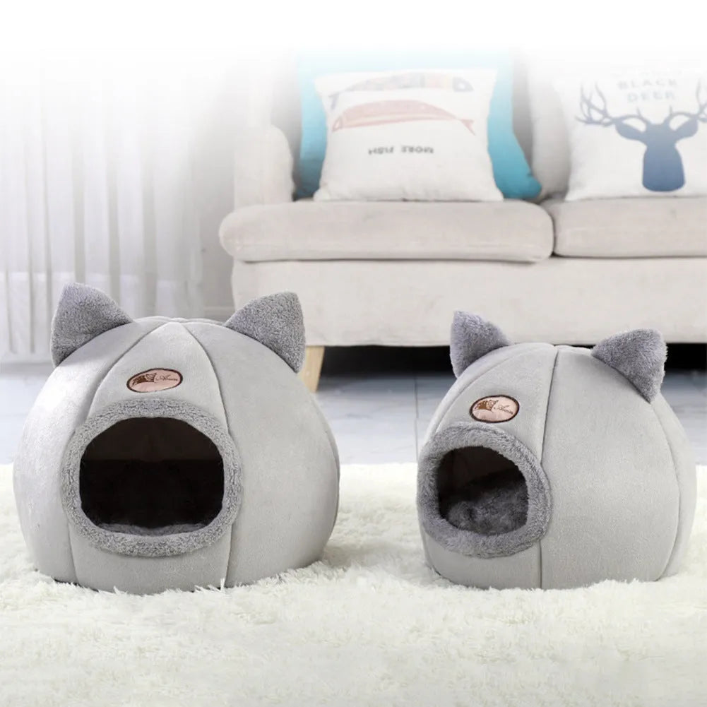 Fully enclosed plush cat winter nest sofa bed with removable cushion, shown in grey